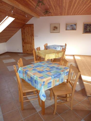 a dining room with a table and chairs at Ubytování Podolí U Křížku in Telč