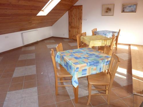 a dining room with a table and chairs at Ubytování Podolí U Křížku in Telč
