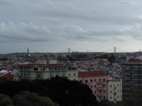 a view of a city with a bridge in the background at Voyage 63 in Lisbon