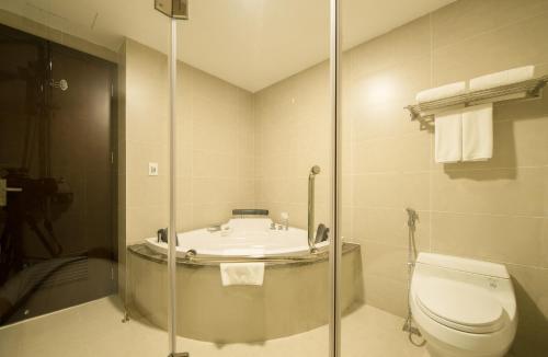 a bathroom with a toilet and a sink at Muong Thanh Hanoi Centre Hotel in Hanoi