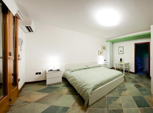 A bed or beds in a room at La Casa di Linda