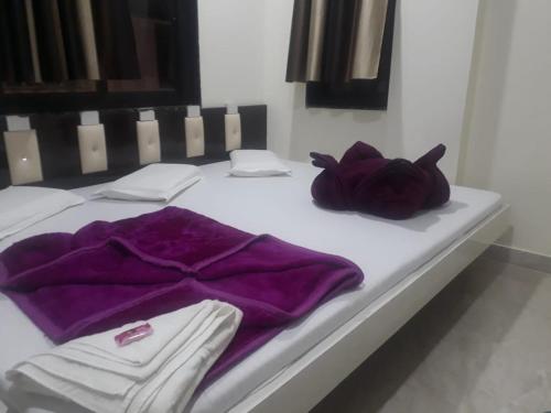 Ένα ή περισσότερα κρεβάτια σε δωμάτιο στο Hotel Arzoo Palace