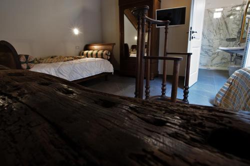 a hotel room with a bed and a mirror at Agriturismo Tenuta Casteldardo in Besenzone