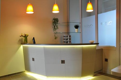 a counter in a room with lights on it at Hotel Bova in Frankfurt/Main