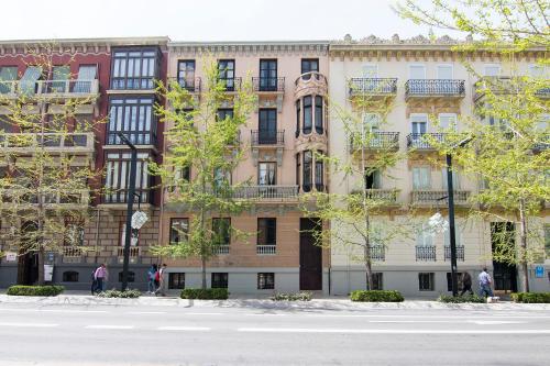an apartment building on the side of a street at ECO Hostel in Granada