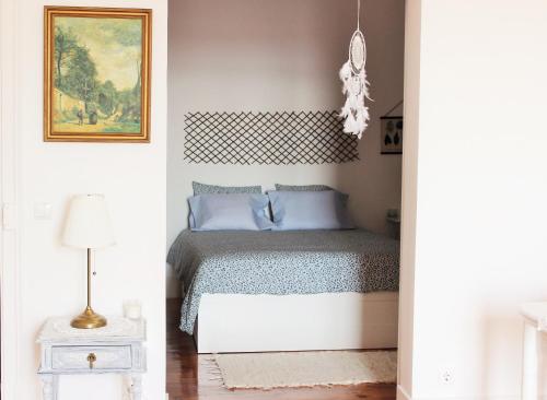 Ένα ή περισσότερα κρεβάτια σε δωμάτιο στο Casa da Varanda Simpática