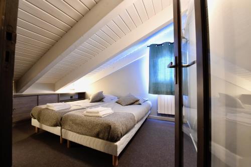 Un pat sau paturi într-o cameră la Au Selaou 34