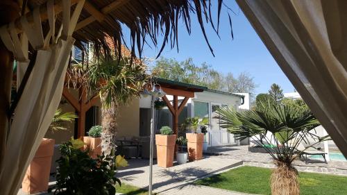 a view of a house with trees and plants at Ferienhaus Apetlon in Apetlon