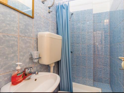 Ванная комната в Apartmani Komoseva