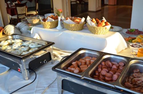 a table with a buffet of different types of food at Hotel Bankya Palace in Bankya