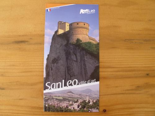 a book on the side of a mountain with a castle at B&B Baratoff in Pesaro
