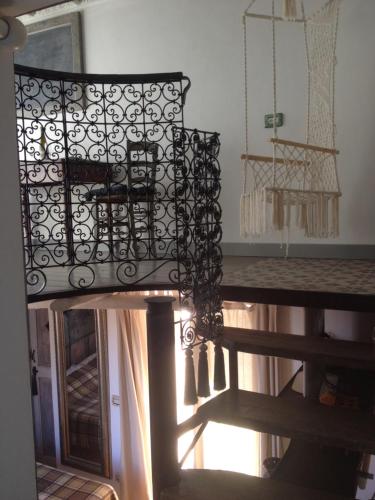 a chandelier hanging from the ceiling in a room at Soqquadro Art&Relax - Spotorno (SV) Sea View in Spotorno