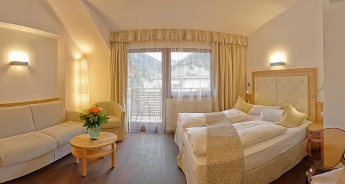 Postel nebo postele na pokoji v ubytování Hotel Leitner
