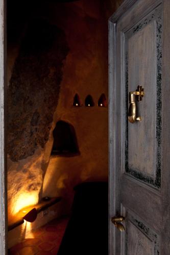 an open door to a room with a fireplace at Soqquadro Art&Relax - Spotorno (SV) Sea View in Spotorno