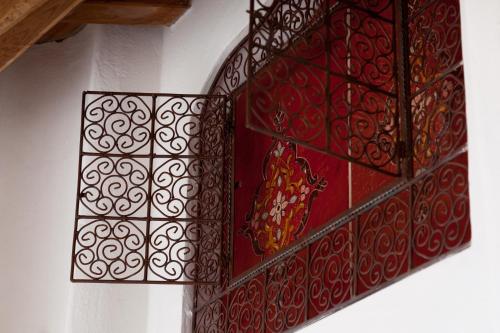 a pair of red glass panels on a wall at Soqquadro Art&Relax - Spotorno (SV) Sea View in Spotorno