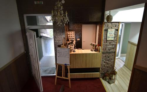 a small kitchen with a counter in a room at Villa Nina Hotel & Lounge bar in Skopje