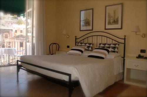 Postel nebo postele na pokoji v ubytování Hotel Relais Modica