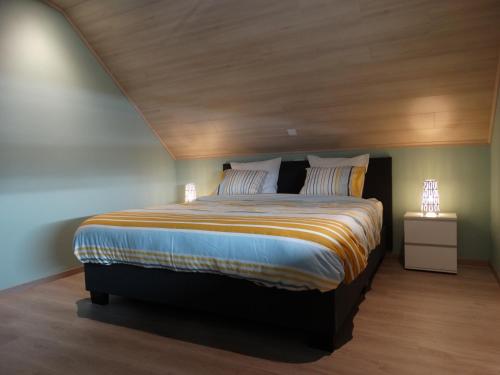 Кровать или кровати в номере De Karaneel