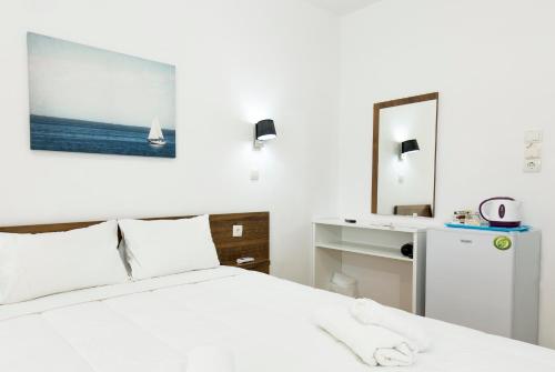 Кровать или кровати в номере Kissamia Rooms - Next to Night Clubs