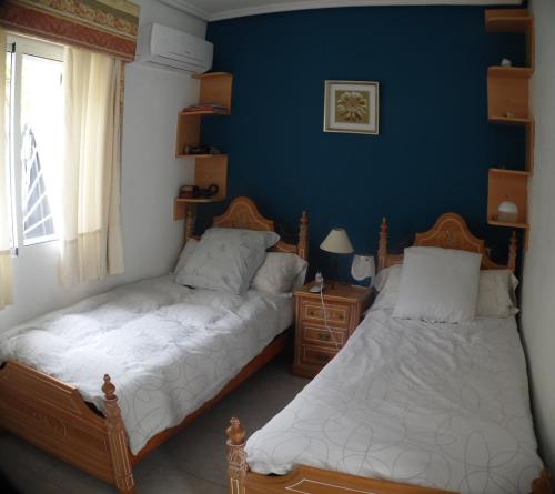 Postel nebo postele na pokoji v ubytování Quesada Golf House