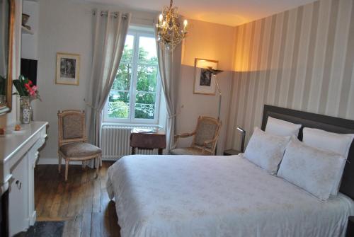 Cama o camas de una habitación en B&b Le Mesnil