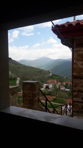 a window with a view of a mountain view at Vernon Villa Stone 1887 in Kastoria