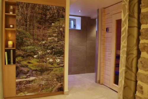 a bathroom with a painting of a japanese garden at Maison de la Garenne & Spa in Vannes