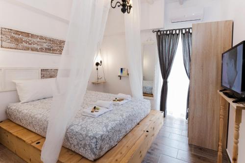 Postel nebo postele na pokoji v ubytování EvaEle Luxury Apartments