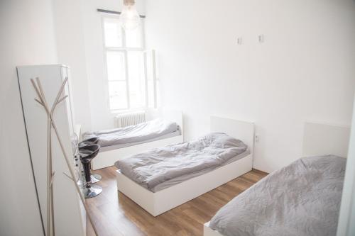 a bedroom with two beds and a window at Lovecroatia Zagreb - 'Pax nest' in Zagreb