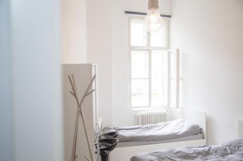 a bedroom with two beds and a window at Lovecroatia Zagreb - 'Pax nest' in Zagreb
