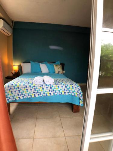 Una cama o camas en una habitación de Hotel y Restaurante Mama Ines