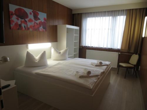 Кровать или кровати в номере Central-Hotel Tegel