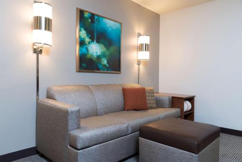 a living room with a couch and a table at Hyatt Place Sarasota/Bradenton in Sarasota
