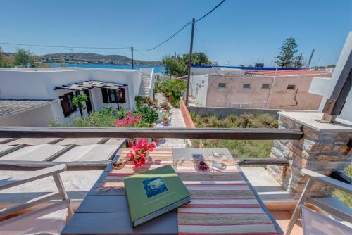 a table on the balcony of a house at Anemologio in Finikas