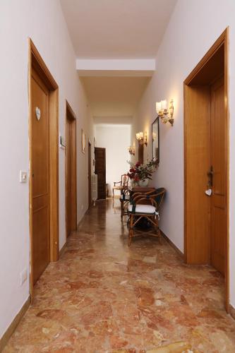 a hallway with a table and chairs in a building at villa oliveta in San Gimignano