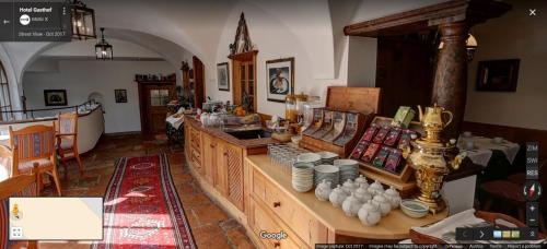 a room with a counter with dishes on it at Gasthof Hotel Doktorwirt in Salzburg
