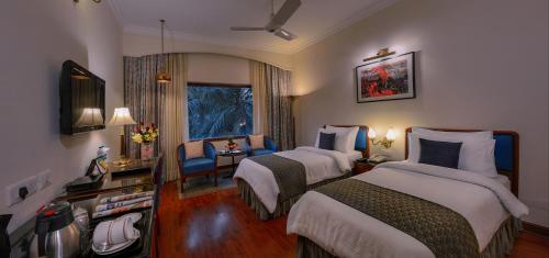 Postel nebo postele na pokoji v ubytování Hotel Clarks Varanasi Limited
