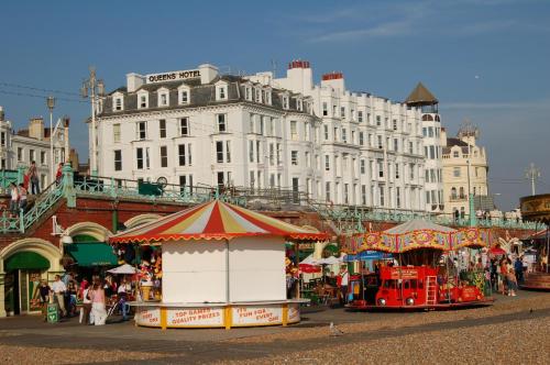 a market in front of a large white building at Queens Hotel & Spa in Brighton & Hove