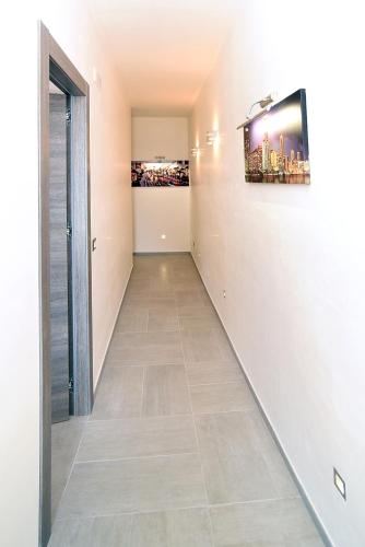 a hallway with a tile floor in a house at The Stunning B&B in Peschici