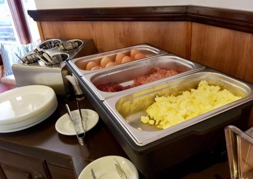 a kitchen with eggs and other food on a table at Nest in Drobeta-Turnu Severin