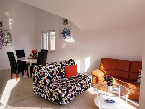 a living room with a couch and a table at Apartments Antonio in Cavtat