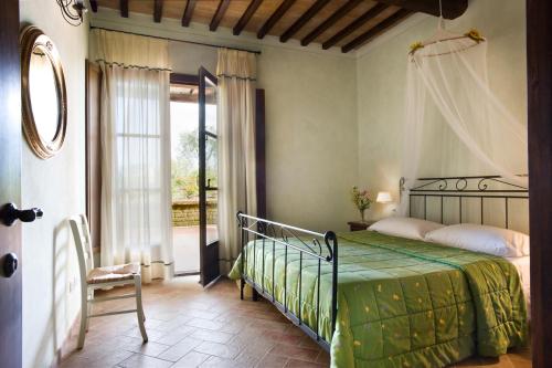 A bed or beds in a room at Agriturismo L'Antica Fornace