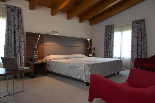 Postel nebo postele na pokoji v ubytování Hotel Del Parco