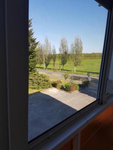 a view from a window of a driveway at Bartók Apartman in Harkány