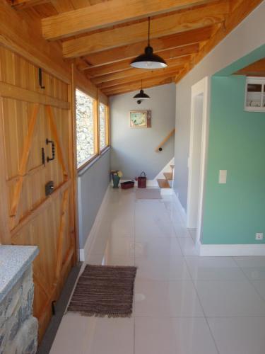 a hallway in a house with a wooden ceiling at Vila Vinha in Arco da Calheta
