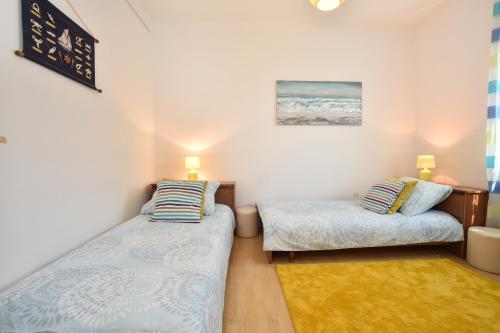 Postel nebo postele na pokoji v ubytování Apartment Bezic