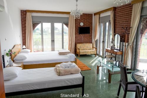 Postel nebo postele na pokoji v ubytování Ionion Star Hotel