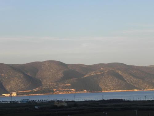 a large body of water with mountains in the background at Apartment Soleal Orikum in Orikum