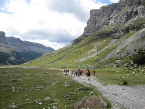 a group of people walking down a mountain trail at Tena Biescas Tourist Home in Biescas