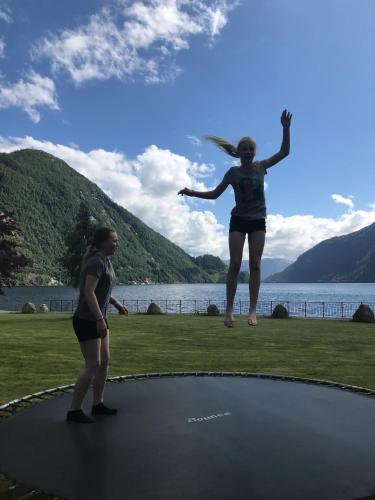 a woman jumping on top of a trampoline at Sogn Hotel in Vadheim